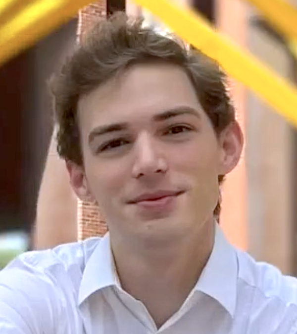 Professional headshot of Maxwell Clarke