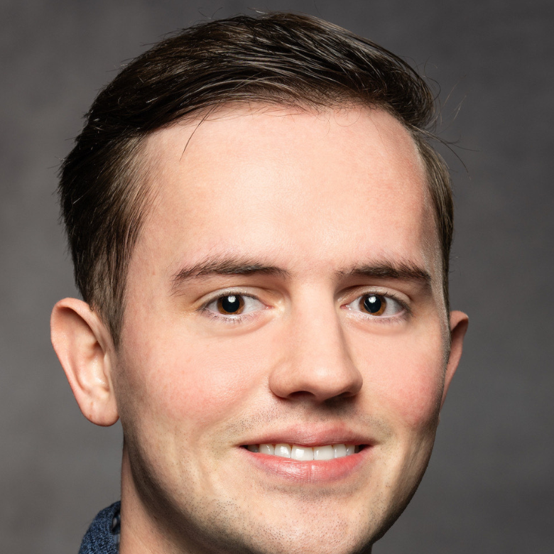 Professional headshot of Cory Meneley